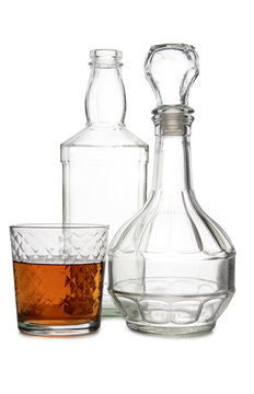 Glass with brandy and cognac on white background