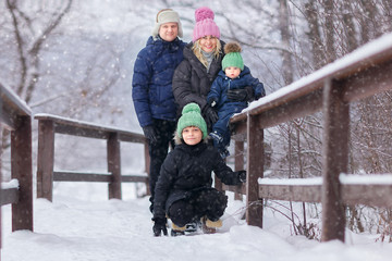 Parents with two sons outdoor. Winter. .