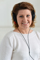 Middle-aged woman with headphones