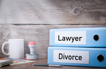 Divorce and Lawyer. Two binders on desk in the office. Business background.