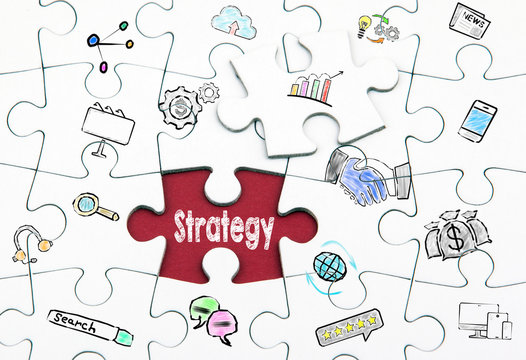 Marketing Strategy concept. White last piece of a Puzzle.