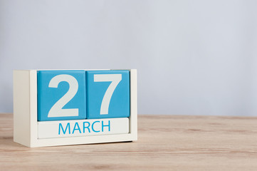 March 27th. Day 27 of month, wooden color calendar on table background. Spring time, empty space for text. World Theatre Days