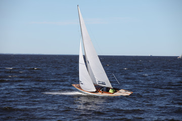Obraz premium classic yacht with white sails in the sea in motion