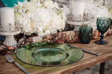 Obraz na płótnie Canvas Wedding table decorated with orchids and candlesticks