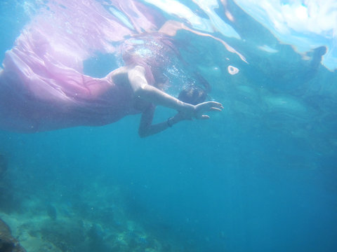 Woman floats underwater