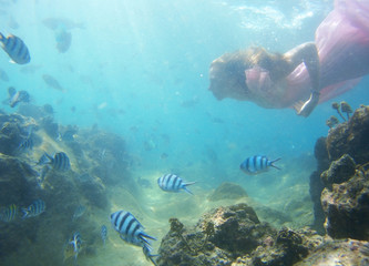 Woman floats underwater