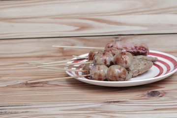 grilled sausage Isaan food Thai, selective focus on wood background