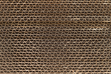 Industrial flat pack single wall cardboard boxes or cartons end view showing the flutes or corrugations © David Pimborough