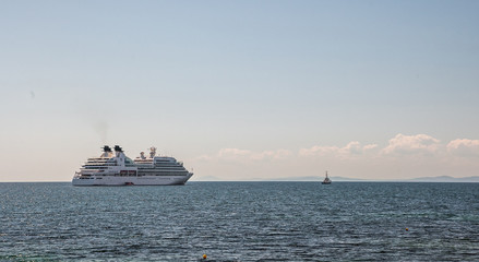 A pilot boat leads a cruise ship along the fairway. Bulgaria.