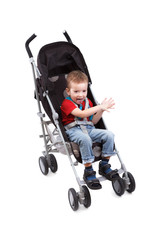 Child in a baby carriage on a white background