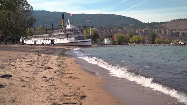 Okanagan Lake beach and SS Sicamous. 4K. UHD. The historic SS Sicamous stern wheeler on display on the beach of Okanagan Lake, BC. 4K. UHD.

