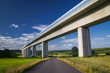 Fototapeta na wymiar Road under a newly built bridge