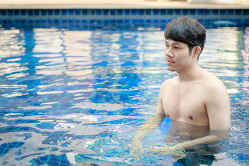 Handsome Asian Man Enjoy In Swimming Pool
