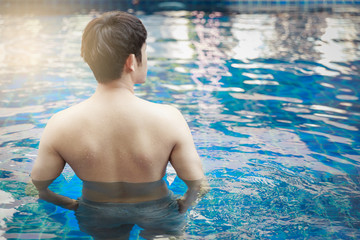 Handsome Asian Man Enjoy In Swimming Pool