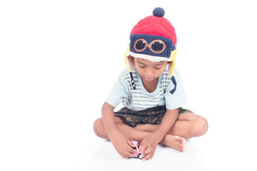 cute asian boy play toy car on white background