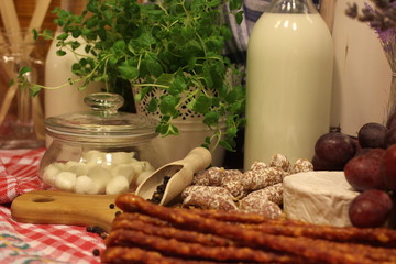 cheeseboard and sausageboard, pepper, sausage, country. county life, country food, herbs, oregano, milk,  grapes, lavender