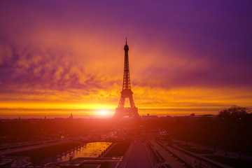 Awesome incredible pink-orange-lilac sunrise. View of the Eiffel Tower from the Trocadero.Beautiful cityscape in backlit morning sunbeam. Paris. France.
