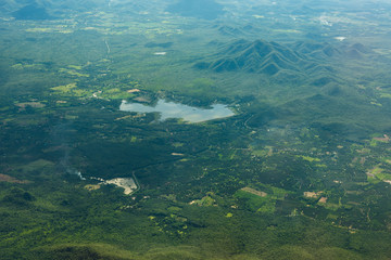 Aerial view of landscape through airplane window, landscape of the mountains, top view of mountains