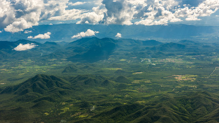 Aerial view of landscape through airplane window, landscape of the mountains, top view of mountains
