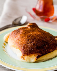 Turkish Dessert Kazandibi / milk baked pudding with tea