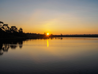 sunrise near the pond on the mountain in Thailand,Silhouettes image