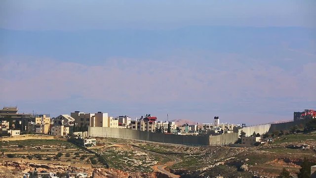 Jerusalem, Ma'ale Adumim at background of jordanian mountains through the shivering warm air