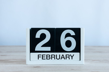 February 26th. Day 26 of month, dayly calendar on wooden table background. Winter time. Empty space for text