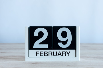 February 29th. Cube calendar for february 29 on wooden desk with empty space For text. Leap year, intercalary day