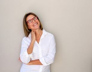 smiling business woman with glasses looking up