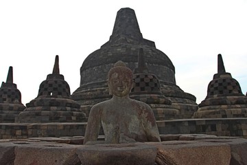 Buddha statue in stupa, Borobudur, near Yogyakarta/Borobudur temple stupas near Yogyakarta, Java, Indonesia/