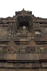 Buddha statue in stupa, Borobudur, near Yogyakarta/Borobudur temple stupas near Yogyakarta, Java, Indonesia/