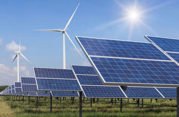 solar cells photovoltaics  and wind turbines generating electricity in  power station alternative...