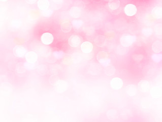 Light pink blurred background.