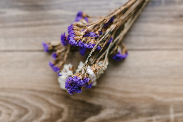 bouquet of wild flowers on a wooden background