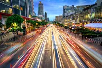 Zelfklevend Fotobehang Busy street at dusk, full of car light streaks © Smileus