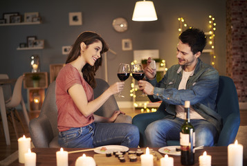 Young couple having toast for lovely evening