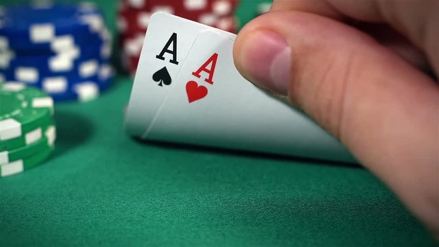 Poker Players Hand Checking Cards, Holding Two Aces