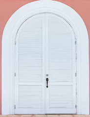 old wooden door in the wall of the building