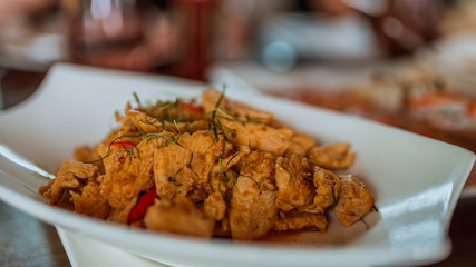 Fried Chicken with a panang curry paste, coconut milk and thai herb.