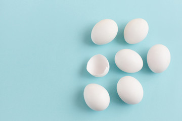 Easter decoration white eggs on a light blue background, minimal design with space for text, horizontal image