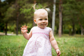 Small cute baby outdoors in the park