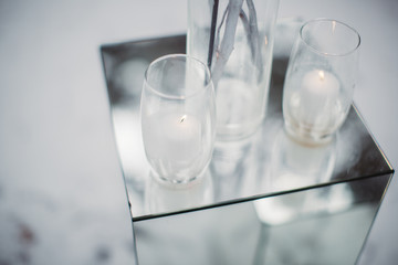 Beautiful stylish candles in the glass close-up