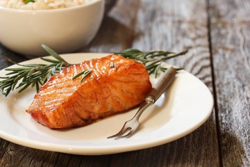 Pan fried salmon with Rosemary garnish, selective focus