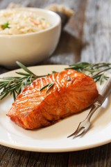 Pan fried salmon with Rosemary garnish, selective focus