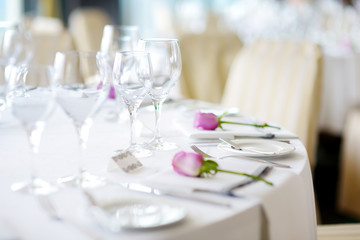 Beautiful table setting with crockery and flowers for a party, wedding reception or other festive event