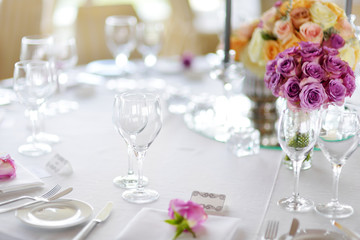 Beautiful table setting with crockery and flowers for a party, wedding reception or other festive event