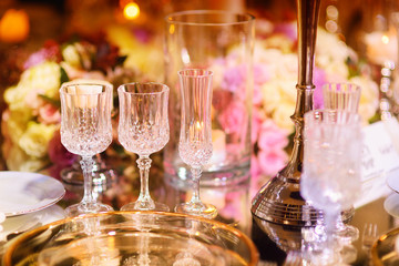 Beautiful table setting with crockery and flowers for a party, wedding reception or other festive event