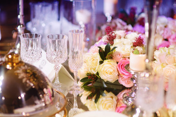 Beautiful table setting with crockery and flowers for a party, wedding reception or other festive event