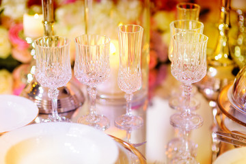 Beautiful table setting with crockery and flowers for a party, wedding reception or other festive event
