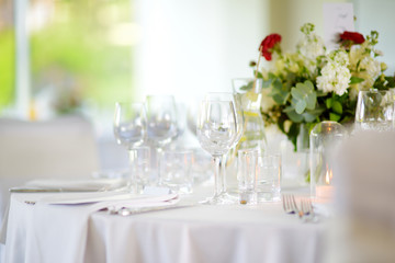 Beautiful table setting with crockery and flowers for a party, wedding reception or other festive event